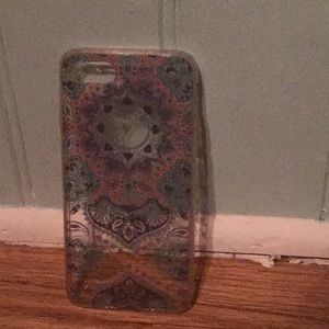 iPhone 6s/7 clear phone case with blue, link, and purple designs on it